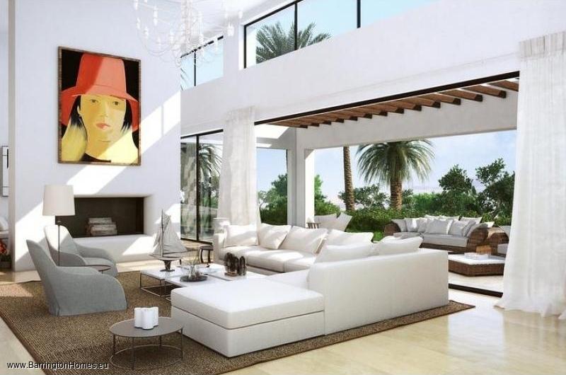 4, 5 & 6 Bedroom Luxury Villas, Finca Cortesin. Model B - 86 m2 living room with fireplace and double high ceiling.